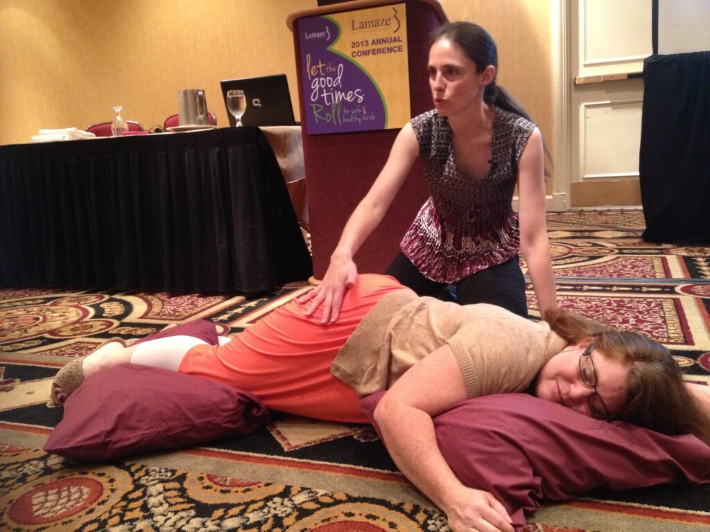 Melinda Delisle teaching massage