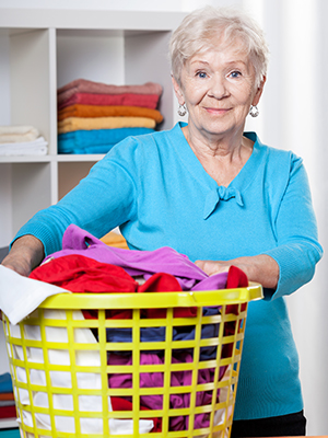 Older woman helping with laundry